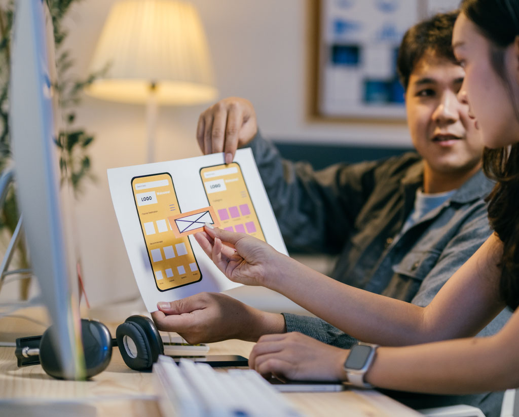 Small business owner reviewing custom Shopify storefront with local web designer