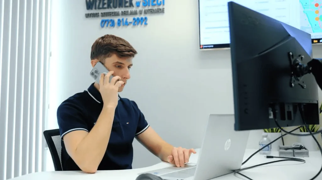 Small business owner reviewing web development agency proposals on a laptop